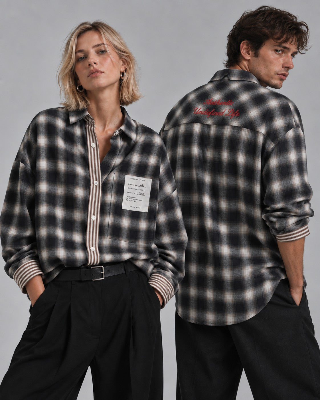 Camisa oversize de cuadro gris y negro AÜL, modelo Authentic Undefined Life, vista frontal en ella y espalda con bordado en él, unisex